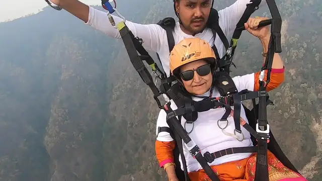 Video thumbnail for 70 years old mom paragliding & singing 🎼.