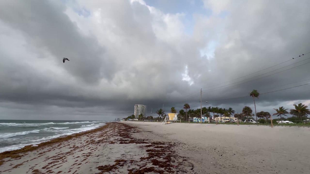 Video thumbnail for US: Dark Morning Clouds Gather Over Hollywood Beach.
