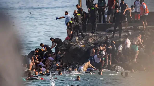 Video thumbnail for What to know about the arrival of 49,000 migrants into Spain's Ceuta