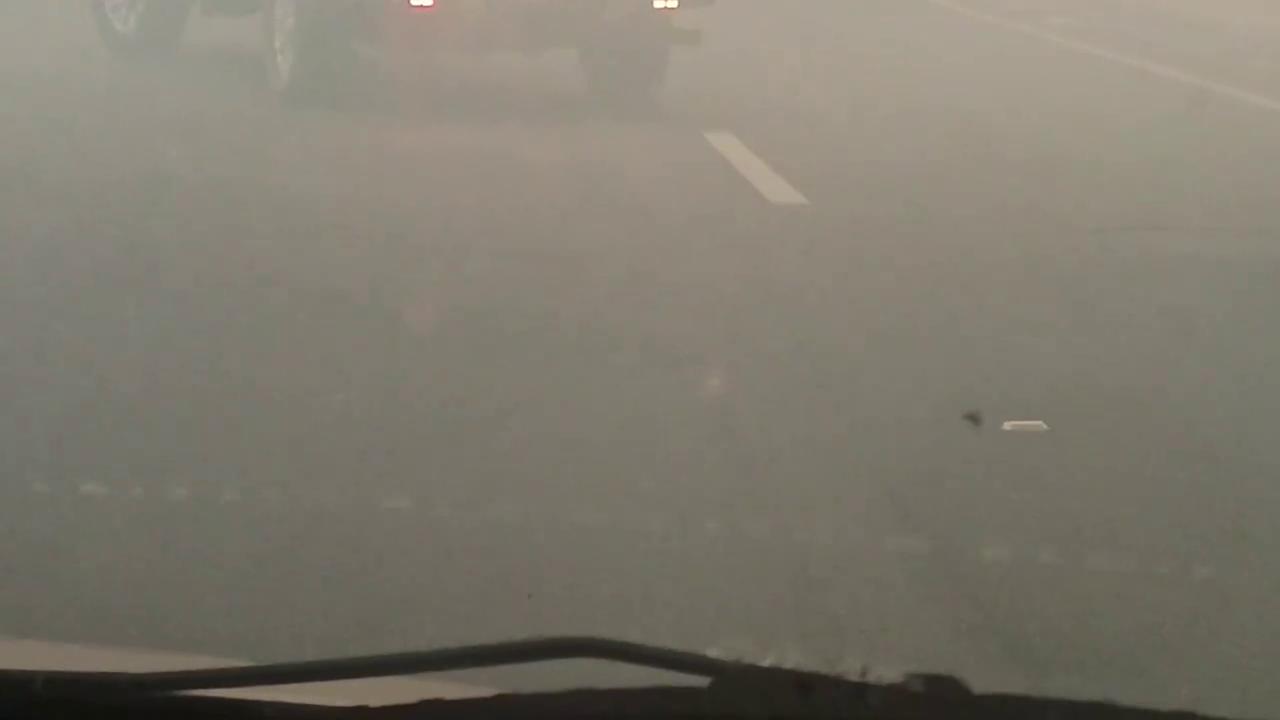 Video thumbnail for US: Drivers Navigate Smoke-Filled Roads as Bain Fire Burns in Riverside County, California.