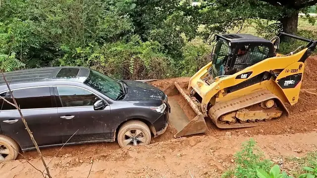 'Video thumbnail for Pulling My Car Out from Mud with Bobcat'