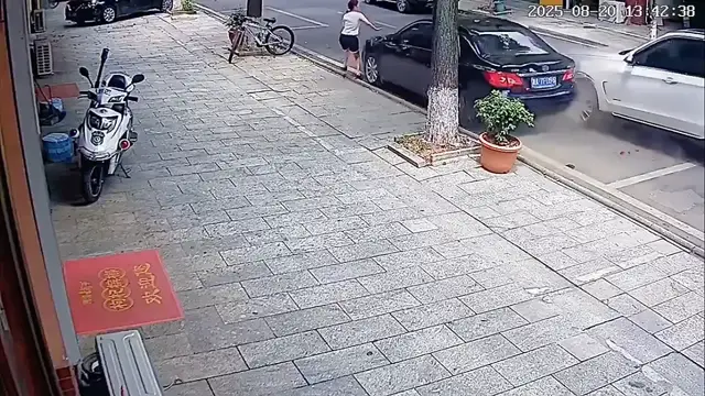 Video thumbnail for Close Call: Car Crash Near Pedestrian in Hunan