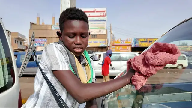 Video thumbnail for Orphaned by Sudan's war, children turn to street work to survive