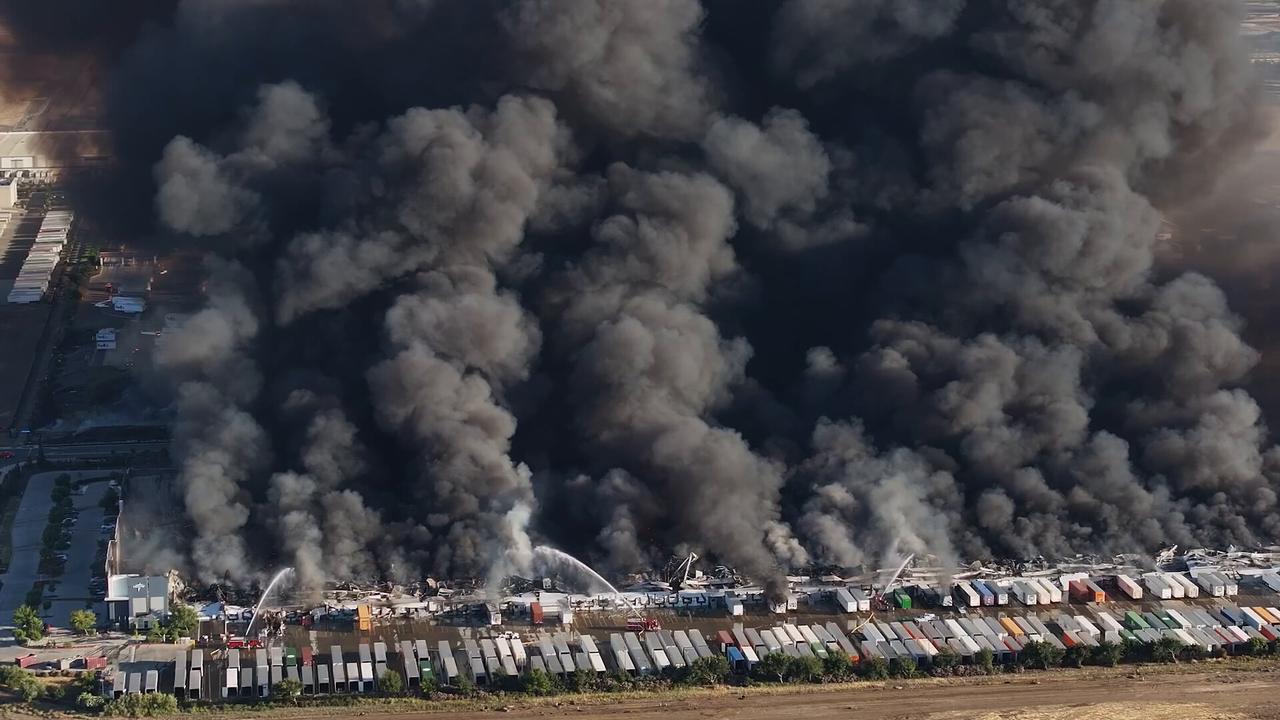 Video thumbnail for US: DRONE - Massive fire engulfs medical supply warehouse in California.