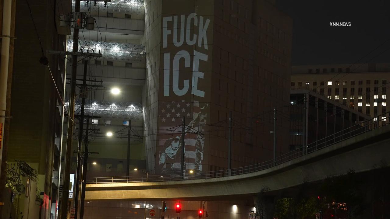 Video thumbnail for US, Los Angeles: Downtown Los Angeles Protest Images Projected at Detention Center.