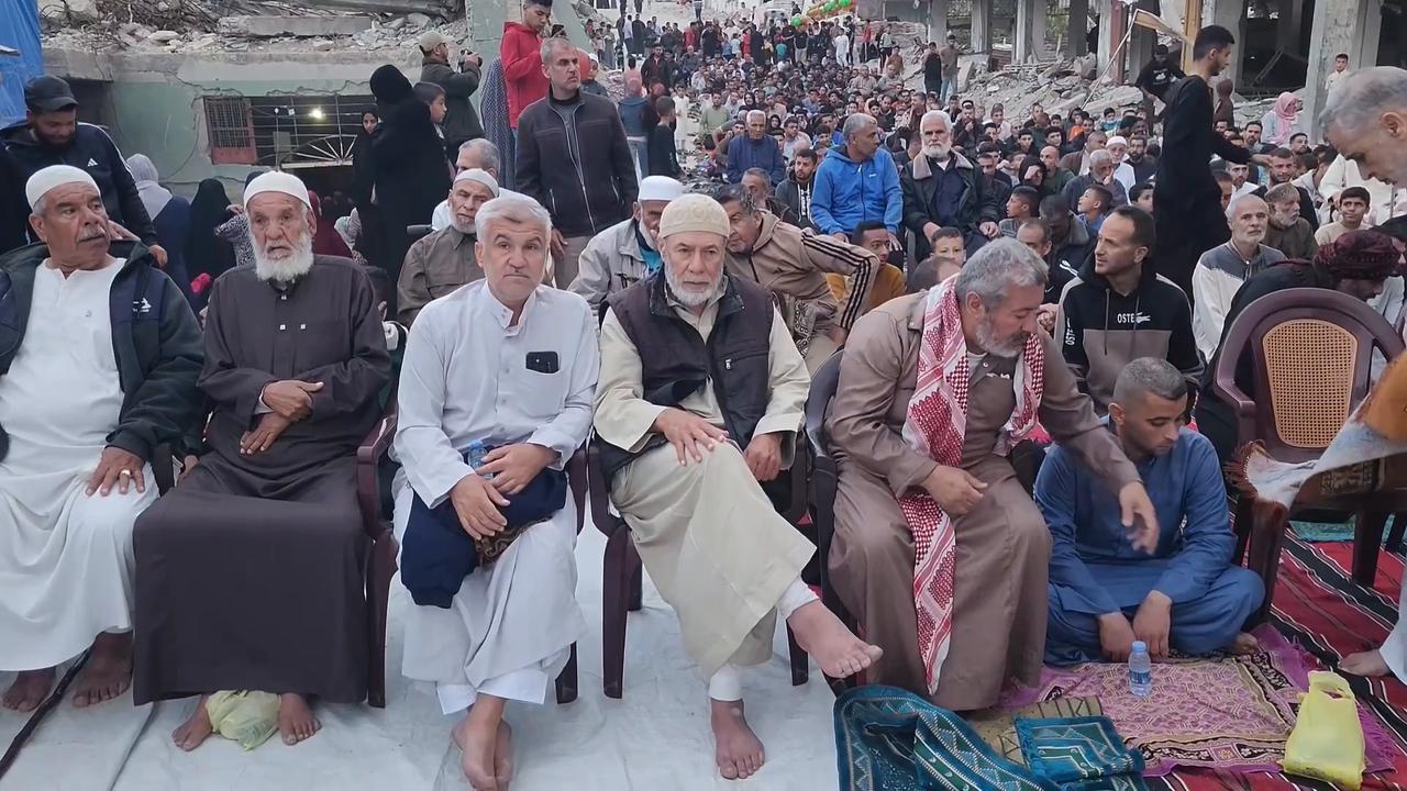 Video thumbnail for Palestinians perform Eid prayer beside destroyed Gaza mosque.