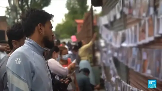 Video thumbnail for Nepal floods: Families gather at overwhelmed morgues in desperate search for loved ones