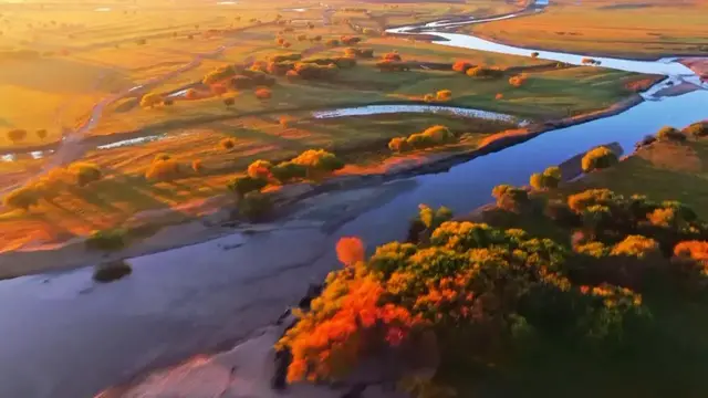 Video thumbnail for China: Mist shrouds wetlands, mountains in dreamlike landscape in Henan.