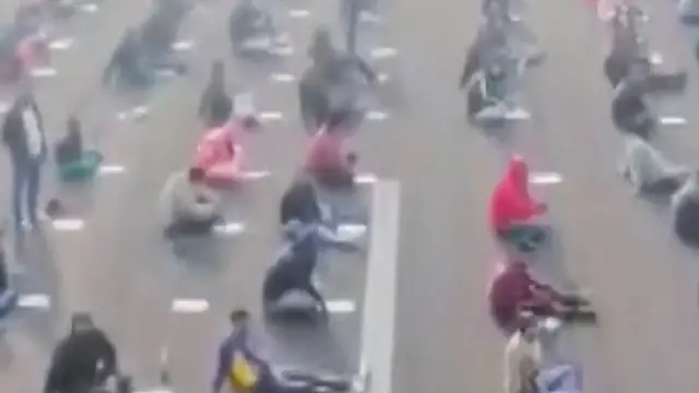 Video thumbnail for Thousands of candidates sit for government exam on airstrip in India