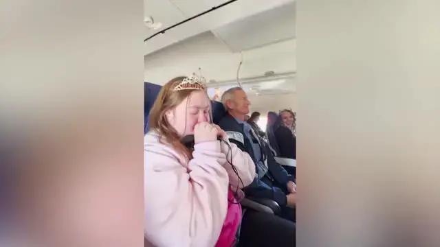 Video thumbnail for Woman With Down Syndrome Lights Up When Entire Plane Sings Happy Birthday To Her | Happily TV