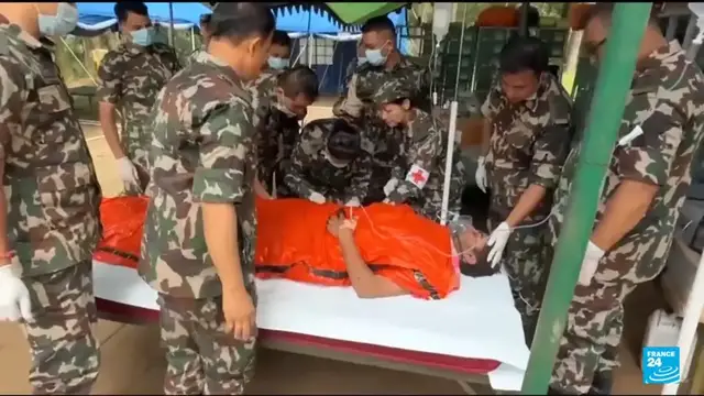 Video thumbnail for Nepal floods: Two workers pulled alive from tunnel after nine days