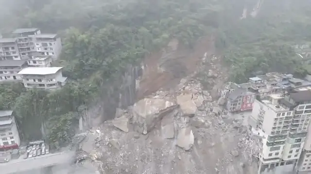 Video thumbnail for China: Landslide buries houses, traps people in southwest China's Chongqing.