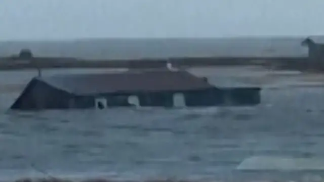 'Video thumbnail for House filmed floating to sea after Typhoon Halong hits Alaska’s coast'
