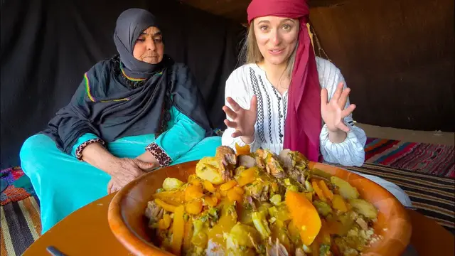 Video thumbnail for Eating with NOMADS in the SAHARA DESERT Medfouna (Berber Pizza) in Morocco!!