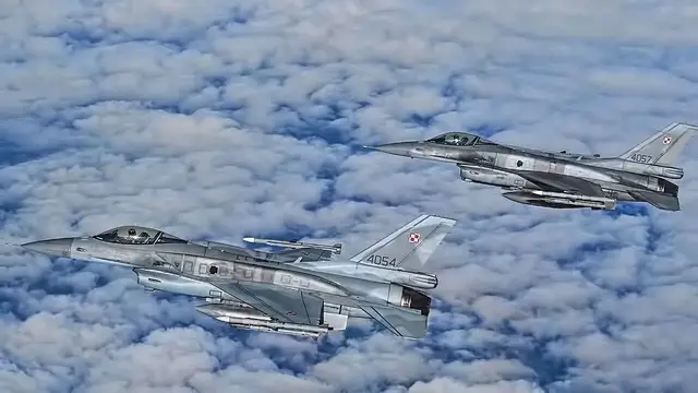 'Video thumbnail for Polish F-16 Fighting Falcons Escort U.S. B-52 Bomber'