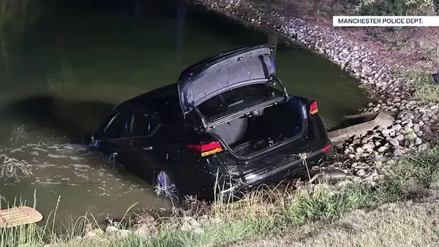 Video thumbnail for Manchester police officers rescue elderly man from sinking car  