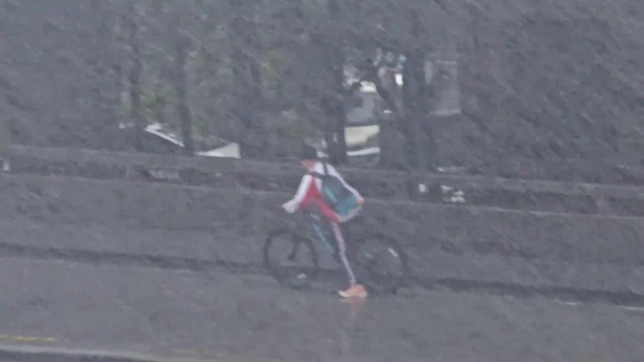 Video thumbnail for China: Chinese boy refused to stop cycling home despite heavy rainstorm.
