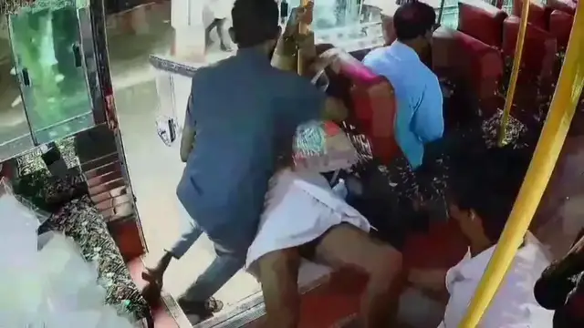 Video thumbnail for India: Bus cleaner turns guardian angel with quick reflexes as elderly passenger nearly falls while boarding bus.