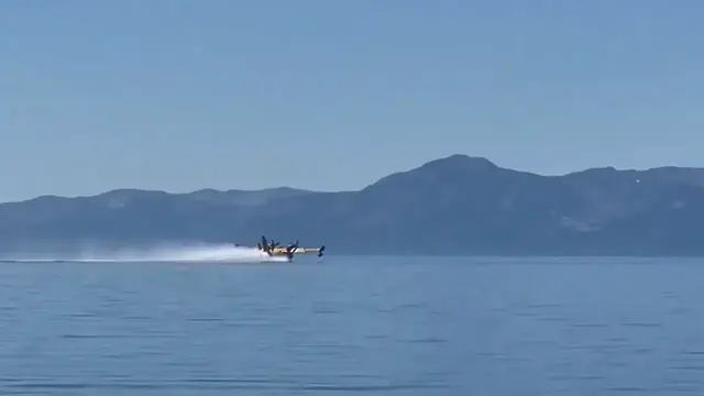 Video thumbnail for Plane Scoops Water From Cedar Beach to Fight the Davis Fire in Nevada