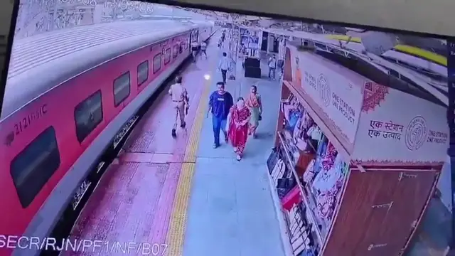 Video thumbnail for India: Swift action from official prevents tragedy as passenger slips from moving train.