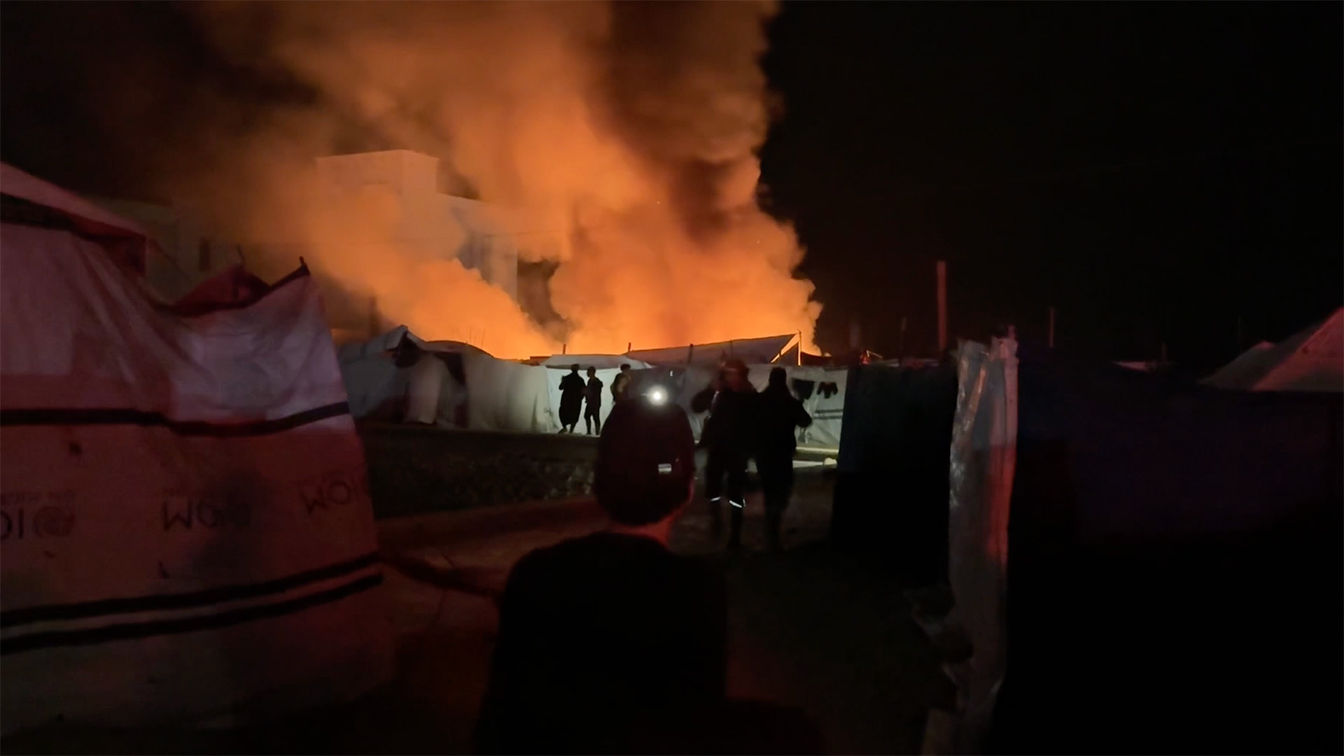 Video thumbnail for Fire erupts at Gaza camp after Israeli attack hits tents