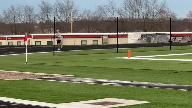 Video thumbnail for Fastest mile dribbling two basketballs