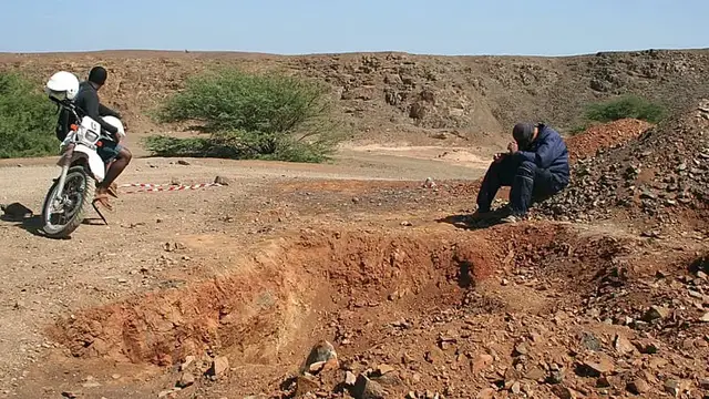 Video thumbnail for Women sand miners toil stripped Cape Verde beach