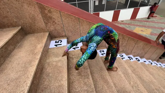 Video thumbnail for Fastest time to ascend and descend 15 stairs in a back bend position - 41.01 seconds by P K Saishriguru