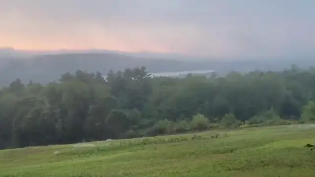 Video thumbnail for US: Maine Sunrise Glows Orange And Gold As Fog Covers The Valley.