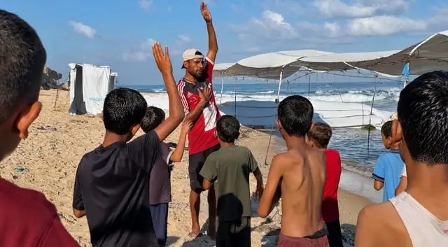 Video thumbnail for Makeshift swimming school gives Gaza children a rare escape from war