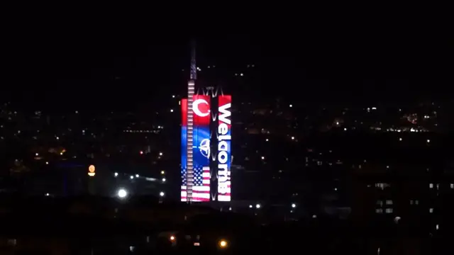 Video thumbnail for Türkiye: NATO member flags projected onto landmark building in Ankara.