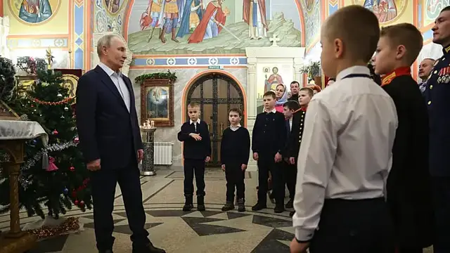 Video thumbnail for Putin attends Orthodox Christmas service with soldiers