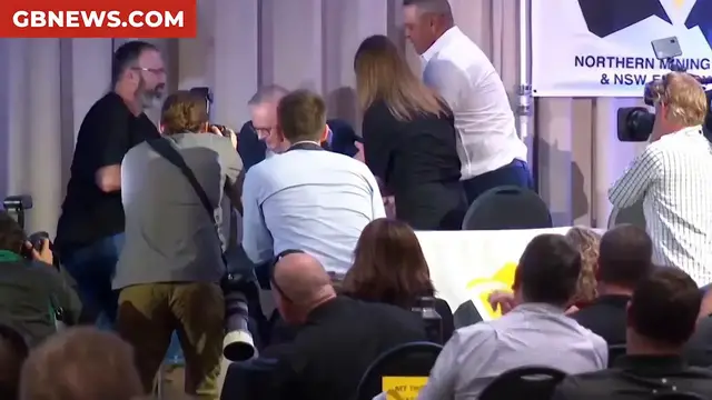 Video thumbnail for Watch the moment the Australian Prime Minister falls off stage during his election campaign