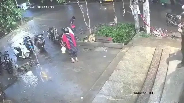 Video thumbnail for India: Cyclist falls into open manhole in Bengaluru.