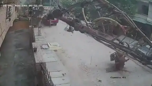 Video thumbnail for India: Dilapidated electricity pole collapses onto road along with transformer, creating sudden hazard for commuters.