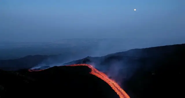 Video thumbnail for Orange lava flows stream from Mount Etna