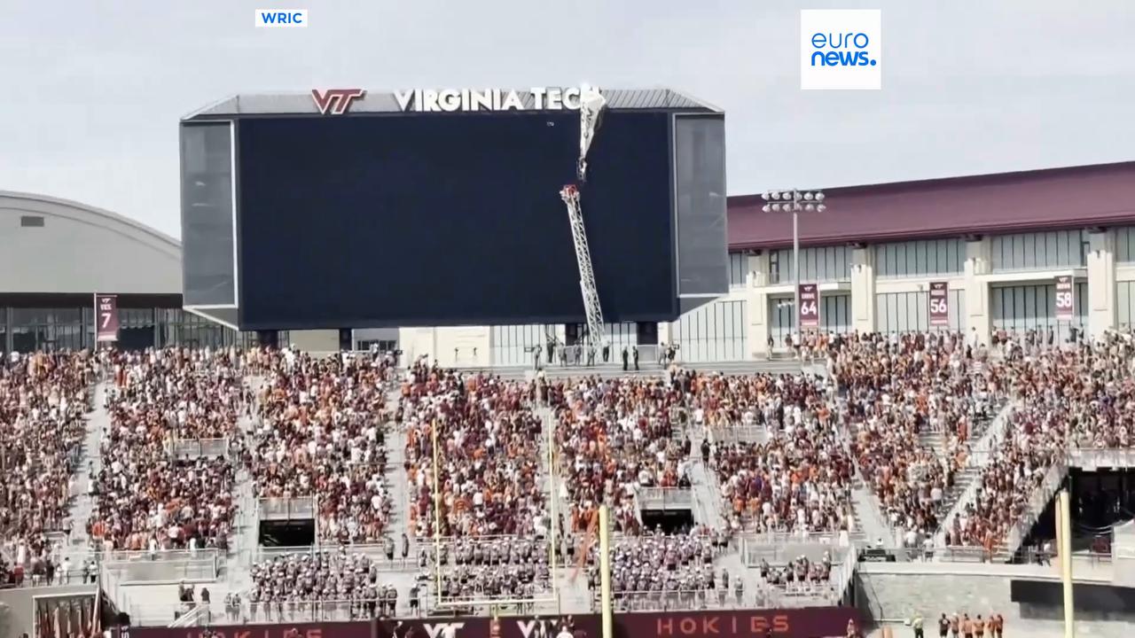 Video thumbnail for Watch: Skydiver crashes into stadium scoreboard in Virginia
