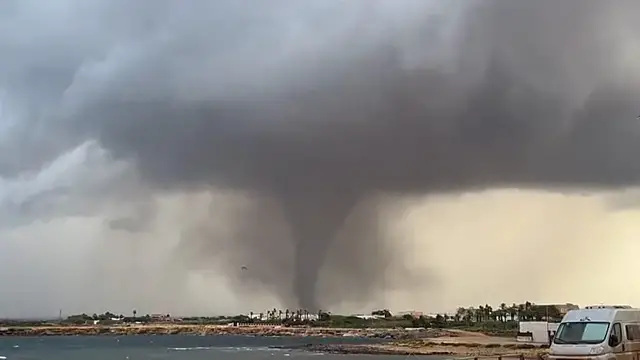 Video thumbnail for Rare waterspouts slam western Sicily, wrecking homes and a school