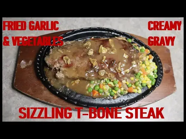 Video thumbnail for SIZZLING T-BONE STEAK WITH CRISPY FRIED GARLIC, MIXED VEGETABLES AND  CREAMY GRAVY. HOMEMADE RECIPE.