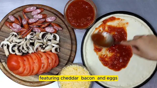 Video thumbnail for Breakfast Pizza with Cheddar, Bacon, and Eggs