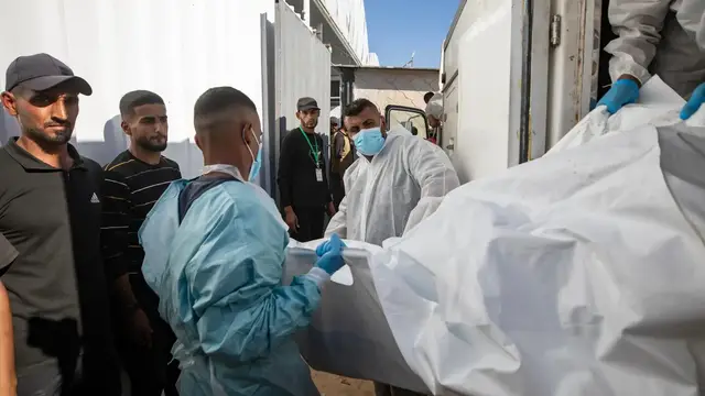 'Video thumbnail for Palestinians trying to identify bodies of loved ones in Gaza'