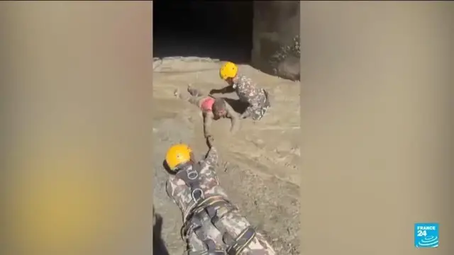 Video thumbnail for Nepal army races to rescue more than 100 trapped in hydropower tunnel after floods