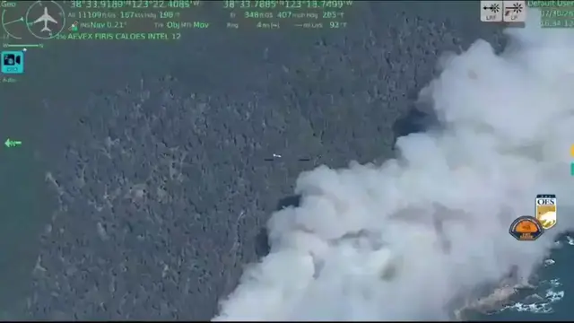 Video thumbnail for US: Air Tanker Drops Fire Retardant As California Wildfire Sends Smoke Over Coast.