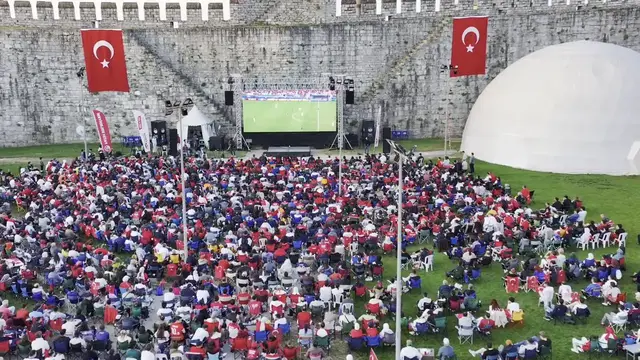 Video thumbnail for Türkiye: Fans gather at Istanbul's historic Yedikule Fortress to watch Türkiye's World Cup clash.