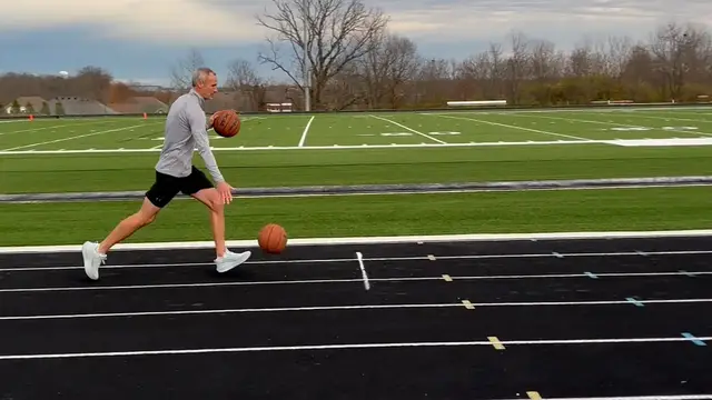Video thumbnail for Fastest mile dribbling two basketballs - 8 minutes 28.31 seconds by Michael Dodd