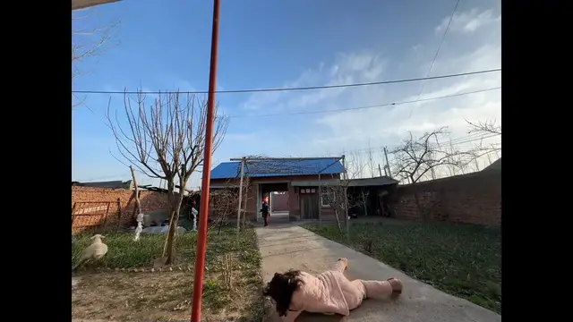 Video thumbnail for Woman Takes a Tumble Chasing Sheep in Henan