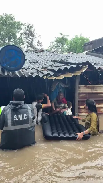 Video thumbnail for Surat Municipal Team Rescues Elderly Woman from Monsoon Floods