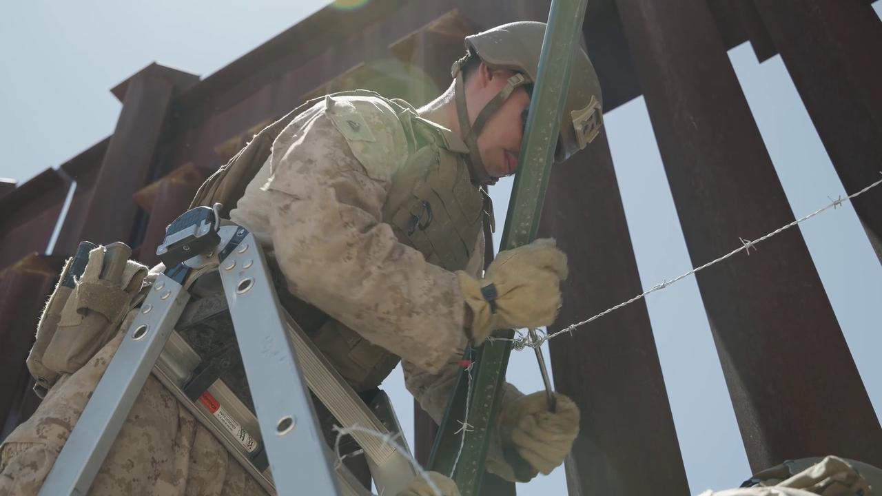 Video thumbnail for US: U.S. Marines Reinforce Mexico Border Barrier With Barbed Wire.