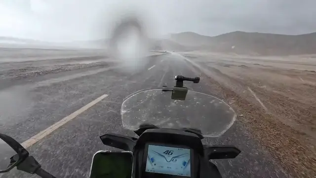 Video thumbnail for China: Motorcyclist braves a sudden hailstorm on Highway 219.