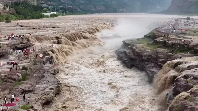 Video thumbnail for China: Hukou Waterfall roars into main flood season.